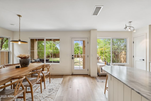 entryway featuring light wood-type flooring and baseboards