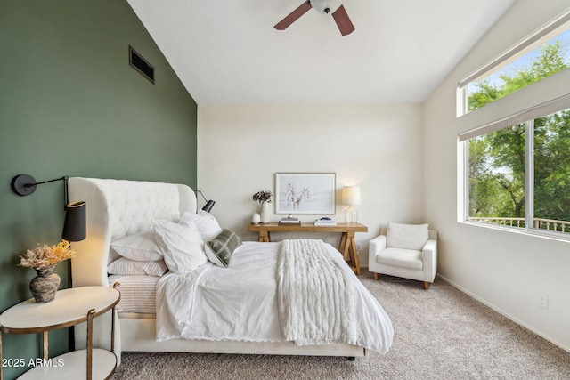 bedroom featuring lofted ceiling, carpet, a ceiling fan, and baseboards