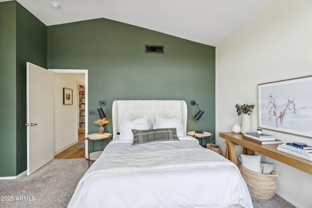 bedroom featuring high vaulted ceiling and baseboards