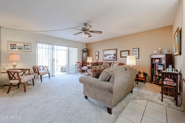 living room with ceiling fan and light colored carpet