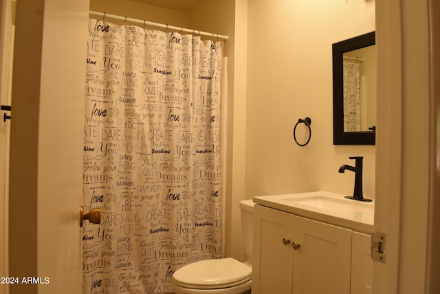 bathroom with vanity, toilet, and a shower with curtain