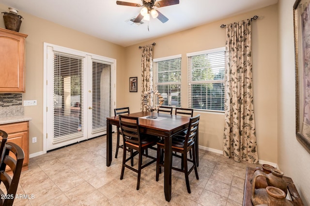 dining area with french doors and ceiling fan