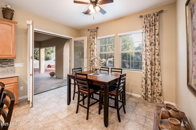 dining room featuring ceiling fan