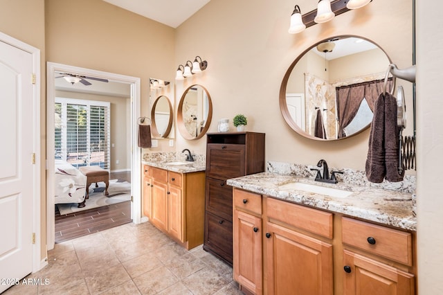 bathroom with ceiling fan and vanity