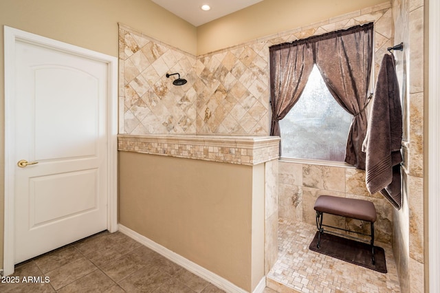 bathroom with tiled shower