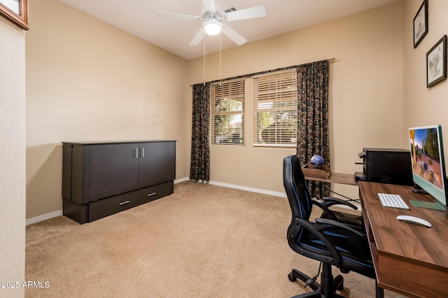 home office with ceiling fan and light carpet