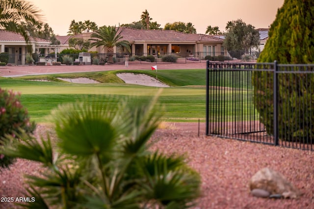 view of property's community with a lawn