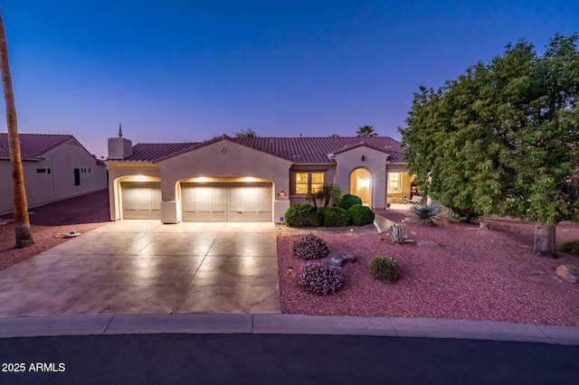 mediterranean / spanish-style house featuring a garage