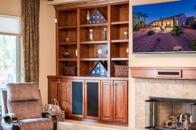 sitting room with a fireplace