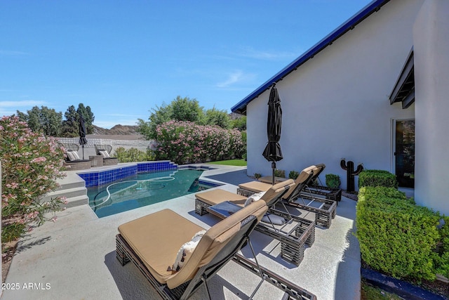 view of swimming pool featuring a patio area and a fenced backyard