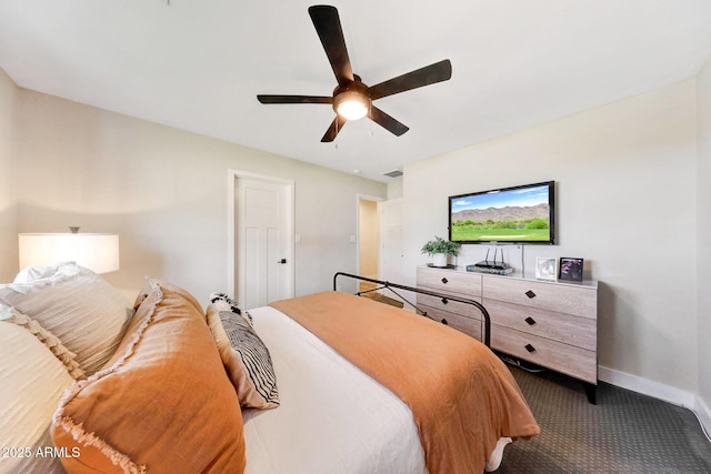 bedroom featuring carpet, baseboards, and a ceiling fan