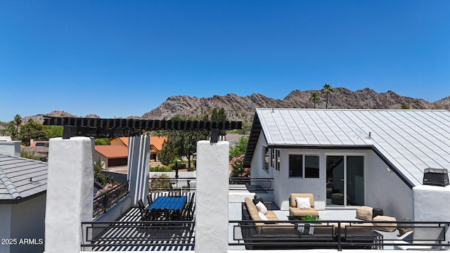 view of patio / terrace with a mountain view and outdoor lounge area