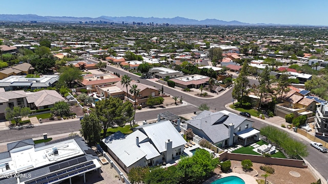 aerial view of residential area featuring a mountain backdrop