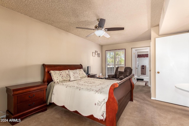 bedroom featuring a textured ceiling, a ceiling fan, and carpet