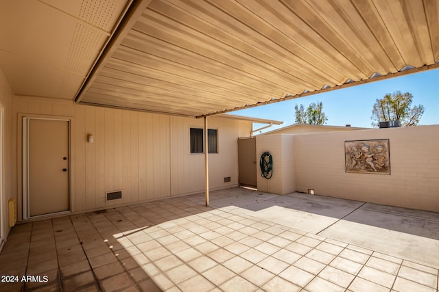 view of patio / terrace with visible vents and fence