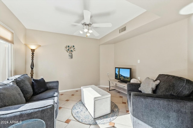 tiled living room featuring ceiling fan