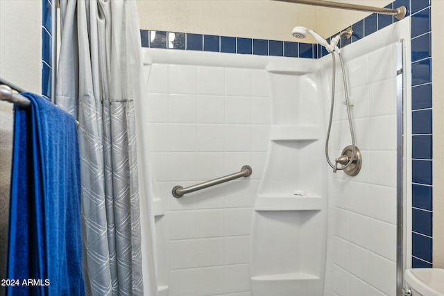 bathroom with a shower with curtain