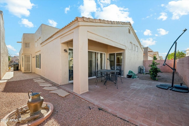 back of house featuring a patio