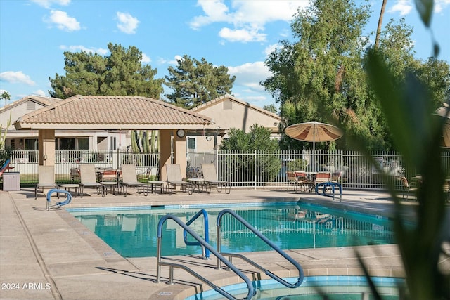 view of swimming pool with a patio