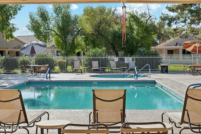 view of swimming pool with a patio area