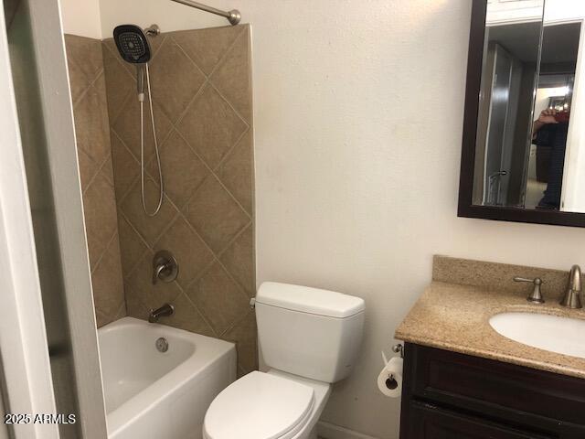 full bath featuring vanity, shower / tub combination, and toilet