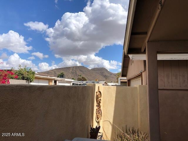 exterior space featuring a mountain view and a balcony