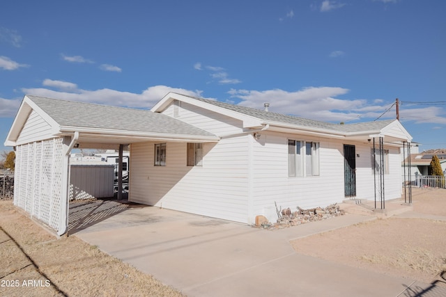 view of front of home with a carport