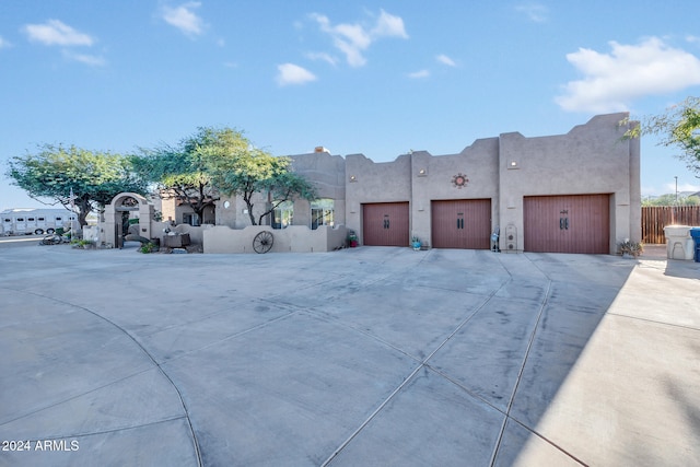 adobe home featuring a garage