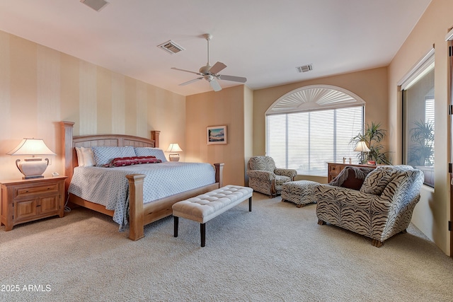 bedroom with light carpet, wallpapered walls, ceiling fan, and visible vents