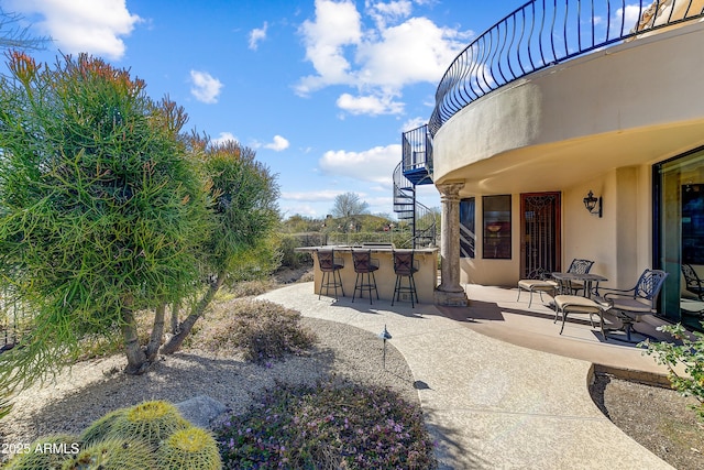 view of patio / terrace with outdoor dry bar