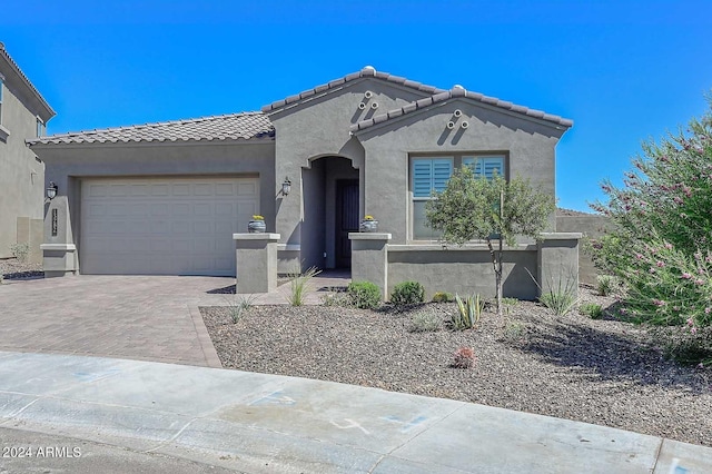 view of front of property with a garage