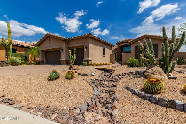 37143 N Greythorn Cir, Carefree, AZ 85377 - mediterranean / spanish-style house with driveway, a tile roof, an attached garage, and stucco siding
