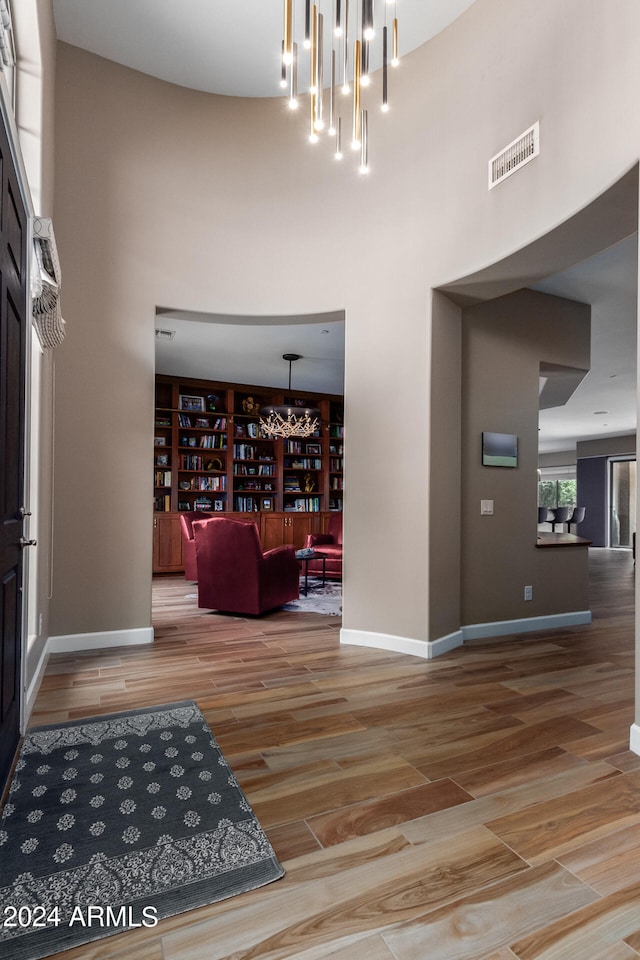 foyer featuring a high ceiling and hardwood / wood-style floors