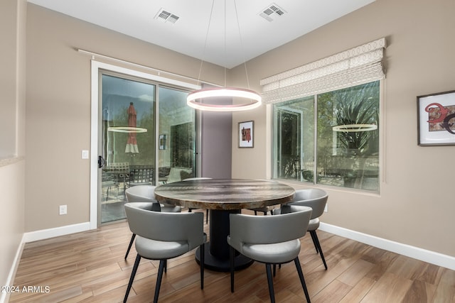 dining space featuring hardwood / wood-style flooring