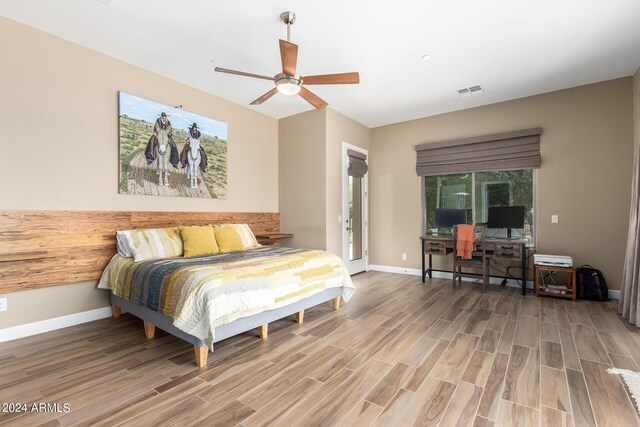 bedroom featuring hardwood / wood-style floors and ceiling fan