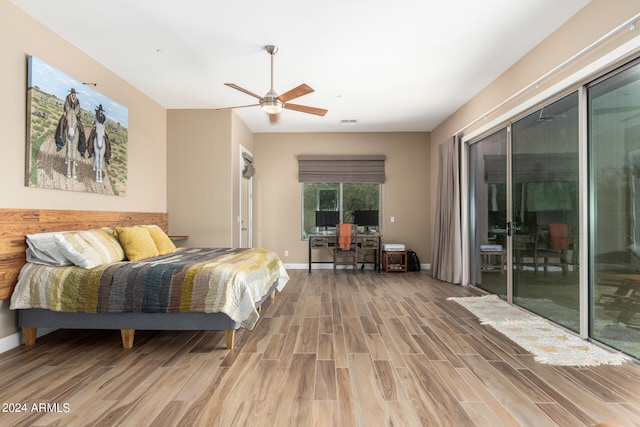 bedroom with wood-type flooring, ceiling fan, and access to exterior