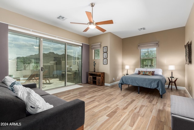 bedroom with access to outside, ceiling fan, and light hardwood / wood-style flooring