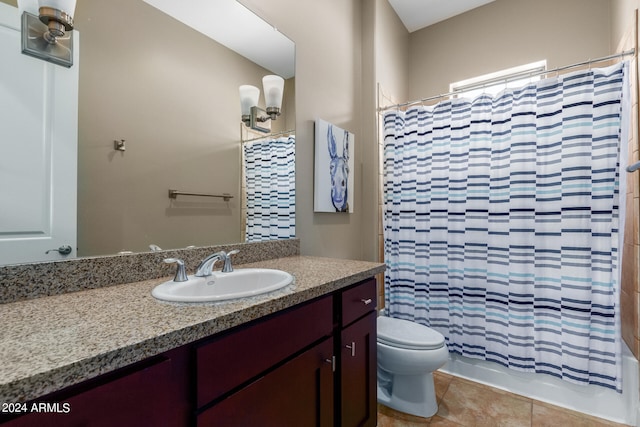 full bathroom with vanity, tile patterned floors, toilet, and shower / tub combo with curtain