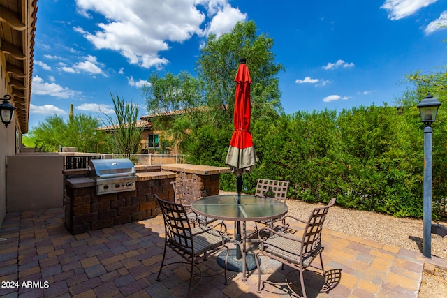 view of patio / terrace with exterior kitchen and area for grilling