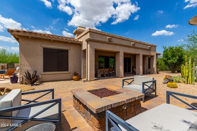 view of patio featuring a fire pit