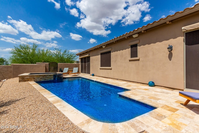 view of pool featuring an in ground hot tub and a patio area