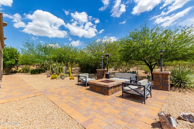 view of patio / terrace with a fire pit