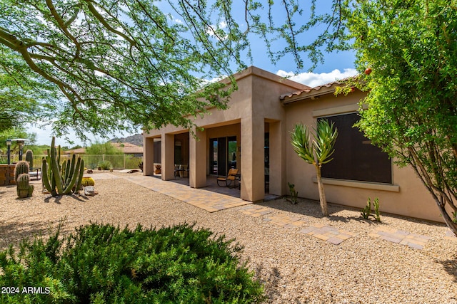 rear view of house with a patio area