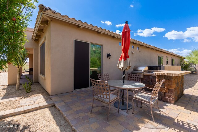 view of patio / terrace featuring area for grilling and grilling area