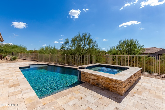 view of pool featuring an in ground hot tub and a patio area