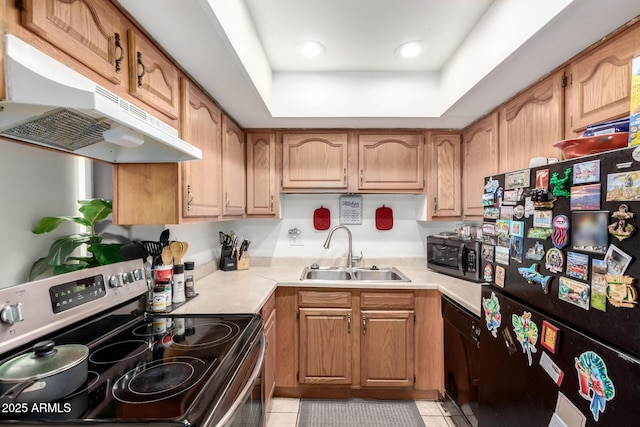 7506 N 47th Dr, Glendale, AZ 85301 - kitchen with a sink, light countertops, under cabinet range hood, black appliances, and light tile patterned flooring