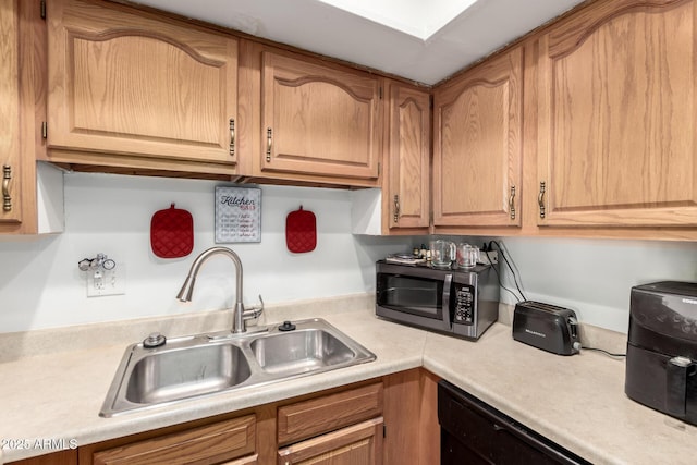 7506 N 47th Dr, Glendale, AZ 85301 - kitchen with a sink, light countertops, stainless steel microwave, and dishwasher