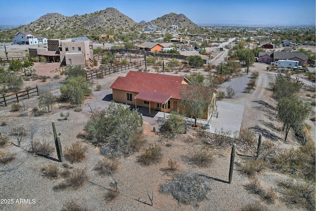 drone / aerial view featuring a residential view and a mountain view