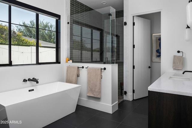 bathroom with independent shower and bath, tile patterned floors, and vanity