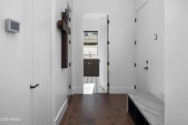 hall with sink and dark hardwood / wood-style floors